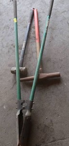 POST HOLE DIGGER, PICK AXE AND SLEDGE HAMMER