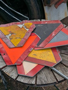 Pile of Farm Implement Caution Signs