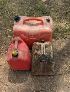 3 Red Older Gas Cans