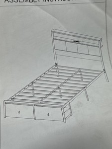 Twin bed with shelves and lights.