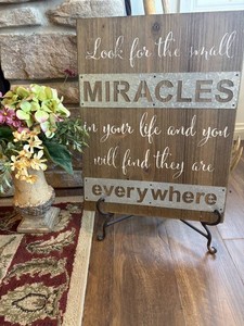 Wood Miracles Sign With Wrought Iron Easel and Vase Arrangement