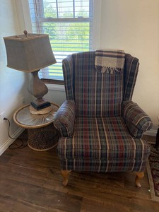 Plaid Wingback Chair, Lamp & Wicker Table