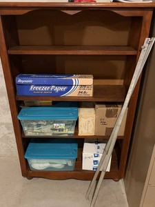Wooden Storage Cabinet With Assorted Contents