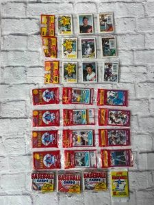 Lot Of 11 Sealed Baseball Card Packs Including Three 1988 Topps Baseball Rack Packs, Four 1988 Score Rack Packs, and More