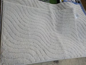 2 Bath Rugs 24 x 17 and 30 x 20...
