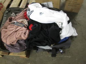 Suitcase filled with ladies clothes...