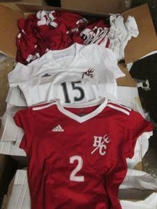 Case of red and white assorted jers...