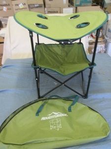 Folding camp table with drink holde...
