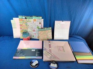 Various new crafting supplies, including a scrapbook kit, themed paper pads, and embellishments.