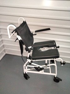 Specialized tilt-in-space rehab shower commode chair