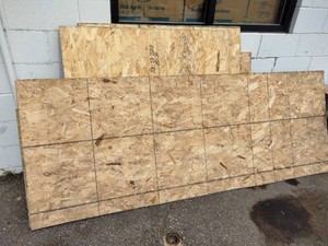 Several Partial Sheet of Oriented Strand Board (OSB) and Plywood