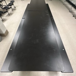 Black collapsible Cafeteria table on wheels with bench seating