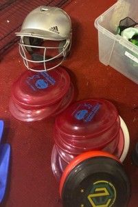 frisbees hockey pucks baseball helmet (Gym)