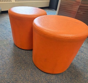 2 orange ottomans