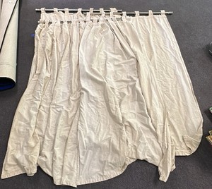 Set of 4 cloth curtains plus 3 silver extendable tension rods.
