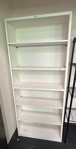 White metal cabinet with adjustable shelving. Hon brand.