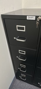 Black filing cabinet with lock and keys