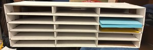 shelf with colored paper