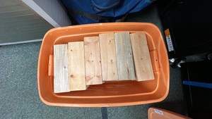 Wood Jenga blocks in orange container