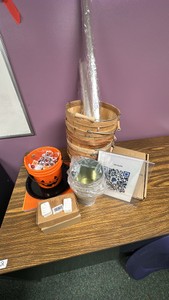 Assortment of Halloween, wicker, baskets, metal, planters, cellophane, and two sizes, 2 boxes of price tags, and three acrylic signs for brochures