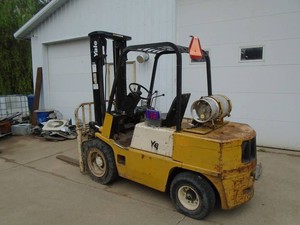 Yale 6000 lb LP forklift. Working condition. With tank. Has minor leaks & may require carb or gas regulator maintenace. It starts but sometimes dies. As shown.