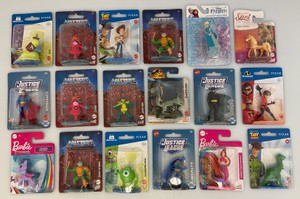 Large group of miscellaneous collectible miniature action figures and more, including justice league, die, cast all new on card