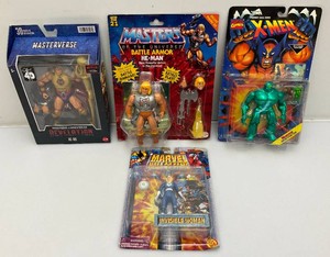 Miscellaneous action figures new in box, including masters of the universe and more.