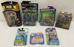 Miscellaneous action figures, including batman and ninja turtles all new on card.