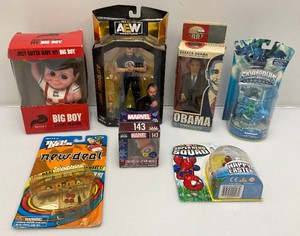 Group of miscellaneous action figures and more, including big boy, wrestling figure and more. All new in box.