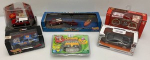 Group of miscellaneous miniature die cast cars, including Hot Wheels and more. All new in box.