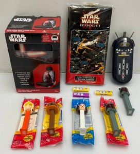 Miscellaneous star wars collectibles, including pez, car seat cover and more