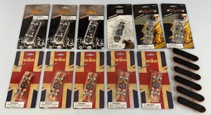 Large group of collectible fingerboard skateboards, miniatures, including kiss and the who all new and packed some loose.