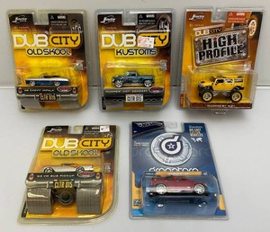 Miscellaneous vintage miniature die cast cars, including Jada toys and hot wheels. All new on card.