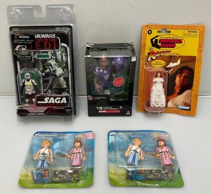 Miscellaneous vintage collectible action figures, including Star Wars and more. All new old stock.