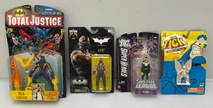 Miscellaneous vintage collectible action figures, including Batman and more. All are new on card.