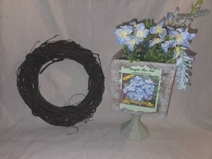 Floral centerpiece and grapevine wreath