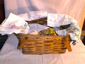 Vintage Picnic style basket with lots of Vintage Linens