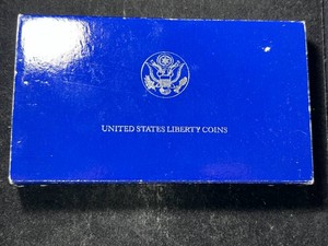 1986 US LIBERTY SILVER DOLLAR AND CLAD HALF DOLLAR SET