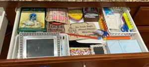 Drawer of misc items, princess Diana brighton, misc note cards and picture frames