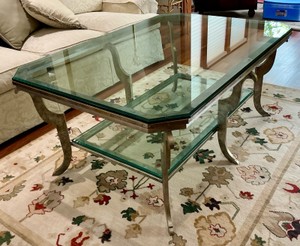 Vintage styled coffee table with gilded iron base and two-tier beveled glass top