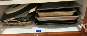 Misc bakeware, cookie sheets, cake pans, cooling rack and more