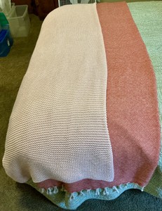 2 lap blankets, pink knit.