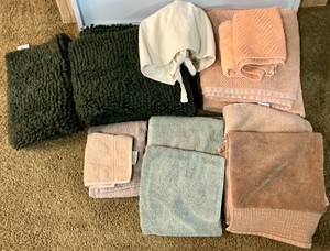 Group of bathroom towels and bath rugs