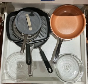 Various pots and pans, Pyrex lids