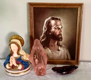 Religious music box, praying hand and a glass mother mary
