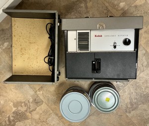 Vintage Kodak Cavalcade Repeater movie Projector and movies on reels in Tin can containers