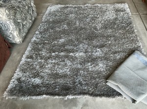 Grey rug with non-slip pad