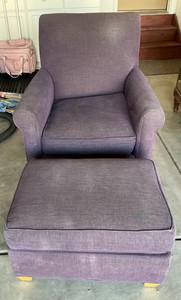 Purple upholstered chair and ottoman