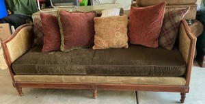 Lillian August Belvedere sofa, high curved frame upholstered in brown leather, distinct bronze nailhead trim