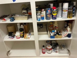 Misc paints, paper cutter, caulking gun, paint brushes, Jb weld,